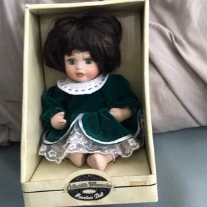 Small porcelain doll new in box